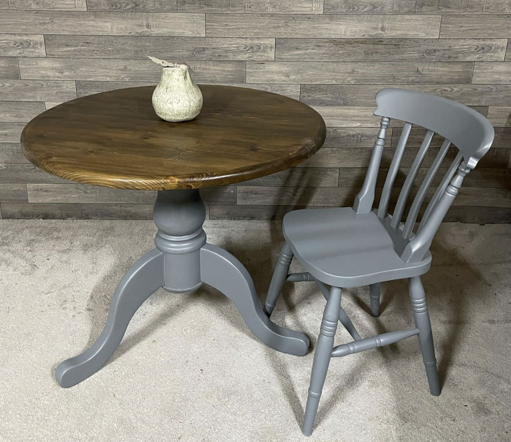 single small table with matching chair which is an example of bespoke furniture customisation as the chair and the legs of the table have been painted grey to match one another