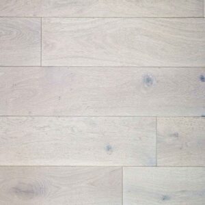 Close-up of a rustic oak floor, showcasing the natural wood grain, textured surface, and warm, earthy tones.