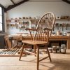 Antique wooden chair restoration process in a workshop, highlighting craftsmanship and sustainability